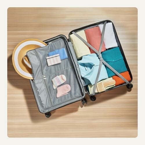Open suitcase with neatly packed colorful clothes and accessories.