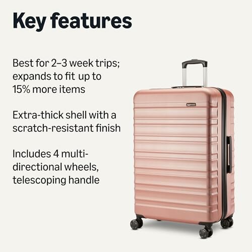 Rose gold suitcase with key features listed: expands for 15% more items, scratch-resistant shell, telescoping handle, four wheels.